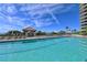 Resort-style beachfront pool with ocean views at 1241 Gulf Of Mexico Dr # 703, Longboat Key, FL 34228