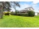 Backyard with screened enclosure and lawn at 1269 Western Pine Cir, Sarasota, FL 34240