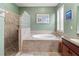 Spa-like bathroom featuring a large walk-in shower and soaking tub at 1269 Western Pine Cir, Sarasota, FL 34240