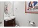Small powder room with a vanity and modern fixtures at 1269 Western Pine Cir, Sarasota, FL 34240