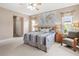 Spacious bedroom with a king-size bed and large windows at 1269 Western Pine Cir, Sarasota, FL 34240