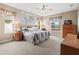 Spacious bedroom with large windows, a dresser and a king-size bed at 1269 Western Pine Cir, Sarasota, FL 34240
