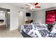 Bedroom with a queen bed, TV, and built-in shelving at 1269 Western Pine Cir, Sarasota, FL 34240