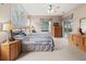 Bright bedroom with king bed, access to pool, and ample closet space at 1269 Western Pine Cir, Sarasota, FL 34240