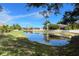 Peaceful view of a canal with lush landscaping and homes along the waterway at 1269 Western Pine Cir, Sarasota, FL 34240