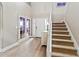 Bright entryway with hardwood floors and staircase at 1269 Western Pine Cir, Sarasota, FL 34240