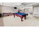 Game room with pool table, and built-in shelving at 1269 Western Pine Cir, Sarasota, FL 34240