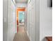Bright hallway with tile flooring and access to bedrooms at 1269 Western Pine Cir, Sarasota, FL 34240