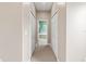 Well-lit hallway with access to multiple bedrooms and bathrooms at 1269 Western Pine Cir, Sarasota, FL 34240