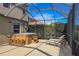 Screened-in patio with hot tub, lounge chairs, and outdoor seating at 1269 Western Pine Cir, Sarasota, FL 34240