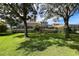 Two-story house with a large backyard and lush landscaping at 1269 Western Pine Cir, Sarasota, FL 34240