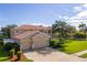 Two-story house with three-car garage and manicured lawn at 1269 Western Pine Cir, Sarasota, FL 34240