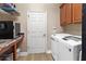 Laundry room with washer, dryer, and extra storage at 1269 Western Pine Cir, Sarasota, FL 34240