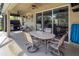 Outdoor dining area with seating for six next to the pool at 1269 Western Pine Cir, Sarasota, FL 34240