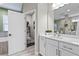 Bright bathroom with a double vanity and a toilet in a separate room at 13891 Heartwood Way, Parrish, FL 34219