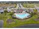 Aerial view of resort-style community pool and clubhouse at 13891 Heartwood Way, Parrish, FL 34219