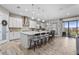 Spacious kitchen with white cabinets, large island, and modern appliances at 13891 Heartwood Way, Parrish, FL 34219