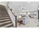 Elegant staircase leading to the second floor living space at 13891 Heartwood Way, Parrish, FL 34219