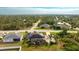 Aerial view of a home with solar panels and a pool, showcasing a desirable neighborhood at 13992 San Domingo Blvd, Port Charlotte, FL 33981