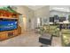 Bright living room with built-in entertainment center and access to other rooms at 146 Yacht Harbor Dr, Osprey, FL 34229