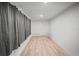 Simple bedroom with light walls and wood floors at 1518 Ewing Ave, Clearwater, FL 33756