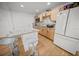 Modern kitchen with granite island, light wood cabinets, and stainless steel appliances at 1518 Ewing Ave, Clearwater, FL 33756