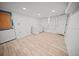 Laundry room with washer, dryer, and light wood floors at 1518 Ewing Ave, Clearwater, FL 33756