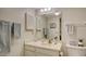 Clean bathroom with vanity, toilet and light blue towels at 153 Wild Palm Dr # 153, Bradenton, FL 34210