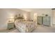 Bedroom with a green wooden headboard and matching nightstands at 153 Wild Palm Dr # 153, Bradenton, FL 34210
