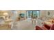 Living room with floral sofa and sliding glass doors at 153 Wild Palm Dr # 153, Bradenton, FL 34210