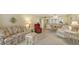 Cozy living room featuring floral sofas and armchairs, creating a comfortable space at 153 Wild Palm Dr # 153, Bradenton, FL 34210