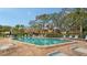 Community pool with surrounding lounge chairs at 153 Wild Palm Dr # 153, Bradenton, FL 34210