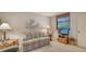 Relaxing sitting area with a sofa, TV, and window seat at 153 Wild Palm Dr # 153, Bradenton, FL 34210