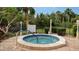 Community hot tub with surrounding landscaping at 153 Wild Palm Dr # 153, Bradenton, FL 34210