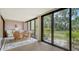 Sunroom with sliding glass doors and view of backyard at 153 Wild Palm Dr # 153, Bradenton, FL 34210