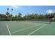 Well-maintained tennis courts with seating area at 153 Wild Palm Dr # 153, Bradenton, FL 34210