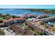 Aerial view of waterfront community with pool and parking at 1618 Stickney Point Rd # 1618-202, Sarasota, FL 34231