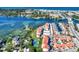 Aerial view of waterfront community with tennis court and pool at 1618 Stickney Point Rd # 1618-202, Sarasota, FL 34231