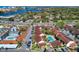 Aerial view of waterfront community with pool and parking at 1618 Stickney Point Rd # 1618-202, Sarasota, FL 34231