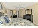 King bedroom with updated flooring, ceiling fan and access to a bathroom at 1618 Stickney Point Rd # 1618-202, Sarasota, FL 34231