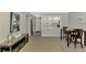 Dining area with table and chairs, kitchen pass-through, and view of entryway at 1618 Stickney Point Rd # 1618-202, Sarasota, FL 34231