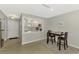 Dining area with table and chairs, kitchen pass-through, and view of entryway at 1618 Stickney Point Rd # 1618-202, Sarasota, FL 34231