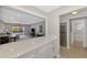 Modern kitchen features white cabinets, quartz countertops, and stainless steel appliances at 1618 Stickney Point Rd # 1618-202, Sarasota, FL 34231