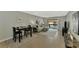 Bright living room with comfy sectional sofa, tile floors, and sliding glass doors to balcony at 1618 Stickney Point Rd # 1618-202, Sarasota, FL 34231