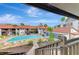 Community pool with surrounding patio and lounge chairs at 1618 Stickney Point Rd # 1618-202, Sarasota, FL 34231