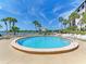 Circular pool with lounge chairs, overlooking the water at 1618 Stickney Point Rd # 1618-202, Sarasota, FL 34231