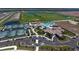 Aerial view of community amenities including pool, clubhouse, and tennis courts at 17520 Gawthrop Dr # 102, Bradenton, FL 34211