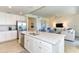 Open concept kitchen with island, stainless steel appliances, and view to living room at 17520 Gawthrop Dr # 102, Bradenton, FL 34211