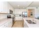 Modern kitchen with stainless steel appliances and white cabinetry at 17520 Gawthrop Dr # 102, Bradenton, FL 34211
