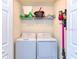 Convenient laundry room with washer, dryer, and shelving at 17520 Gawthrop Dr # 102, Bradenton, FL 34211